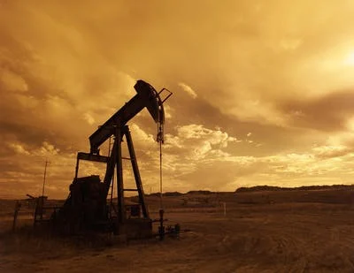 An oil drilling rig in an open field