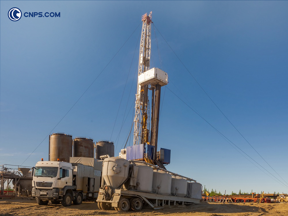 Drilling rig setup in a field.
