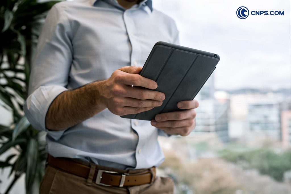 man holding a tablet