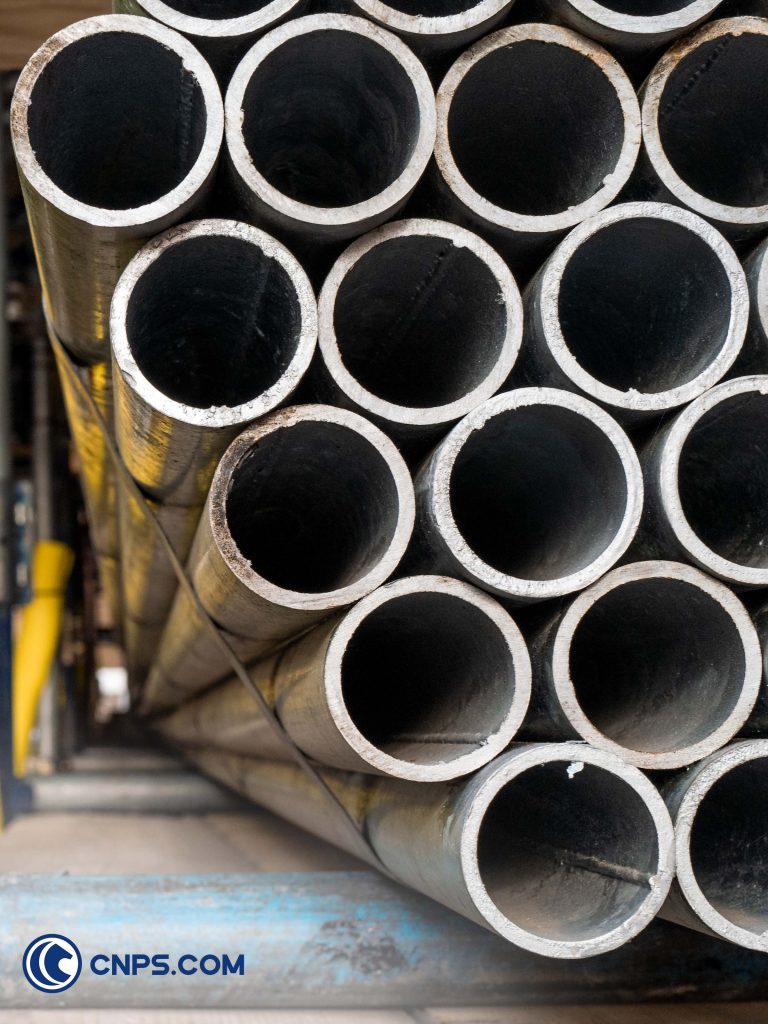 Stacked steel pipes.
